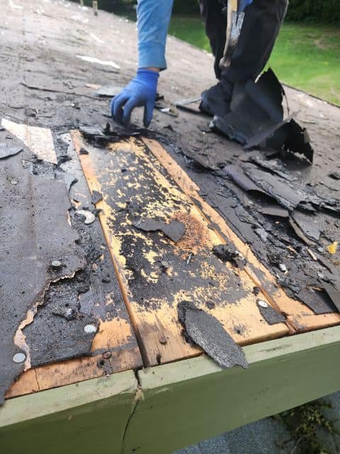 Roof decking exposed during tear-off by RJ Roofing