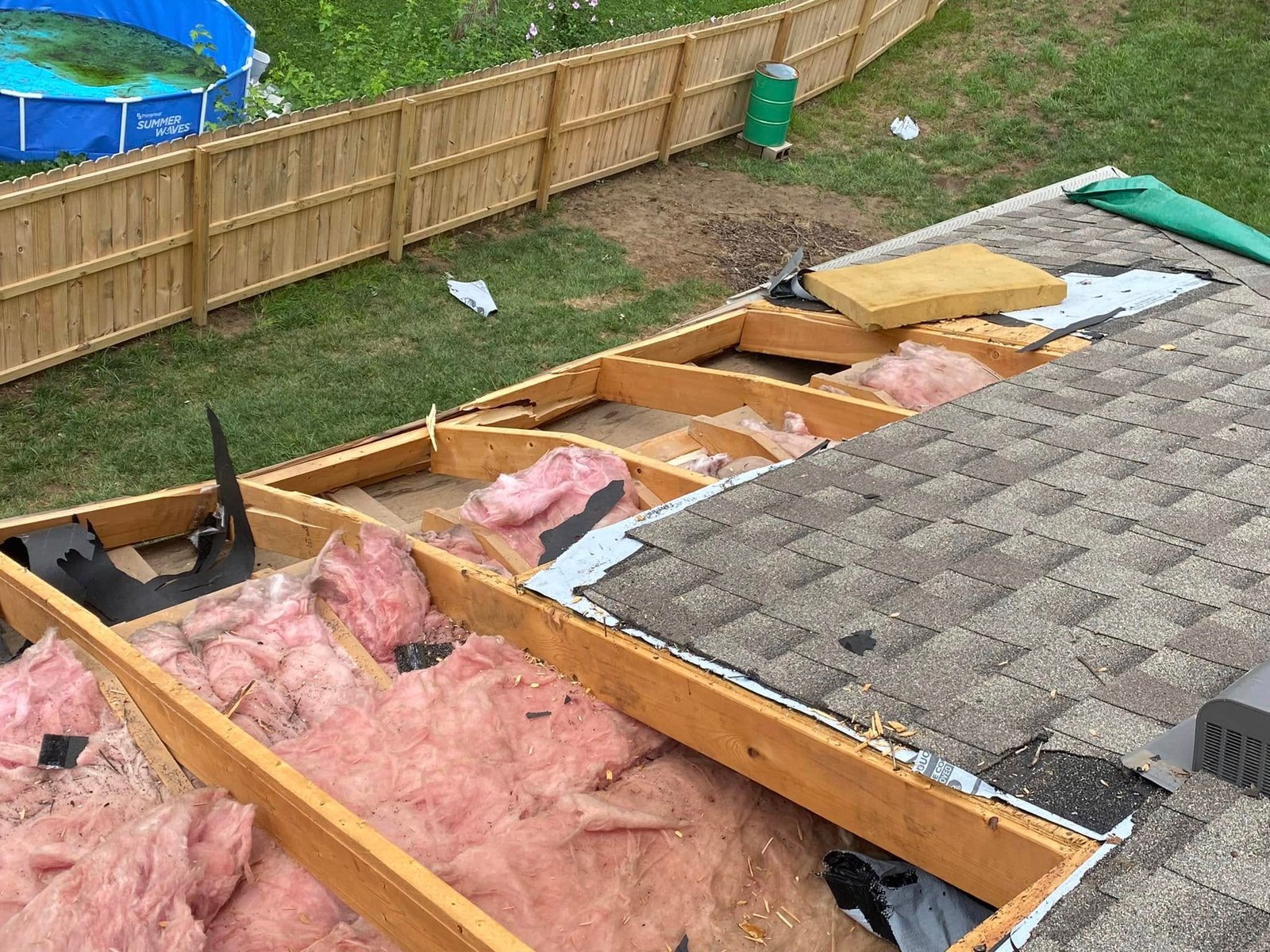 Exposed attic showing roof structure during inspection by RJ Roofing