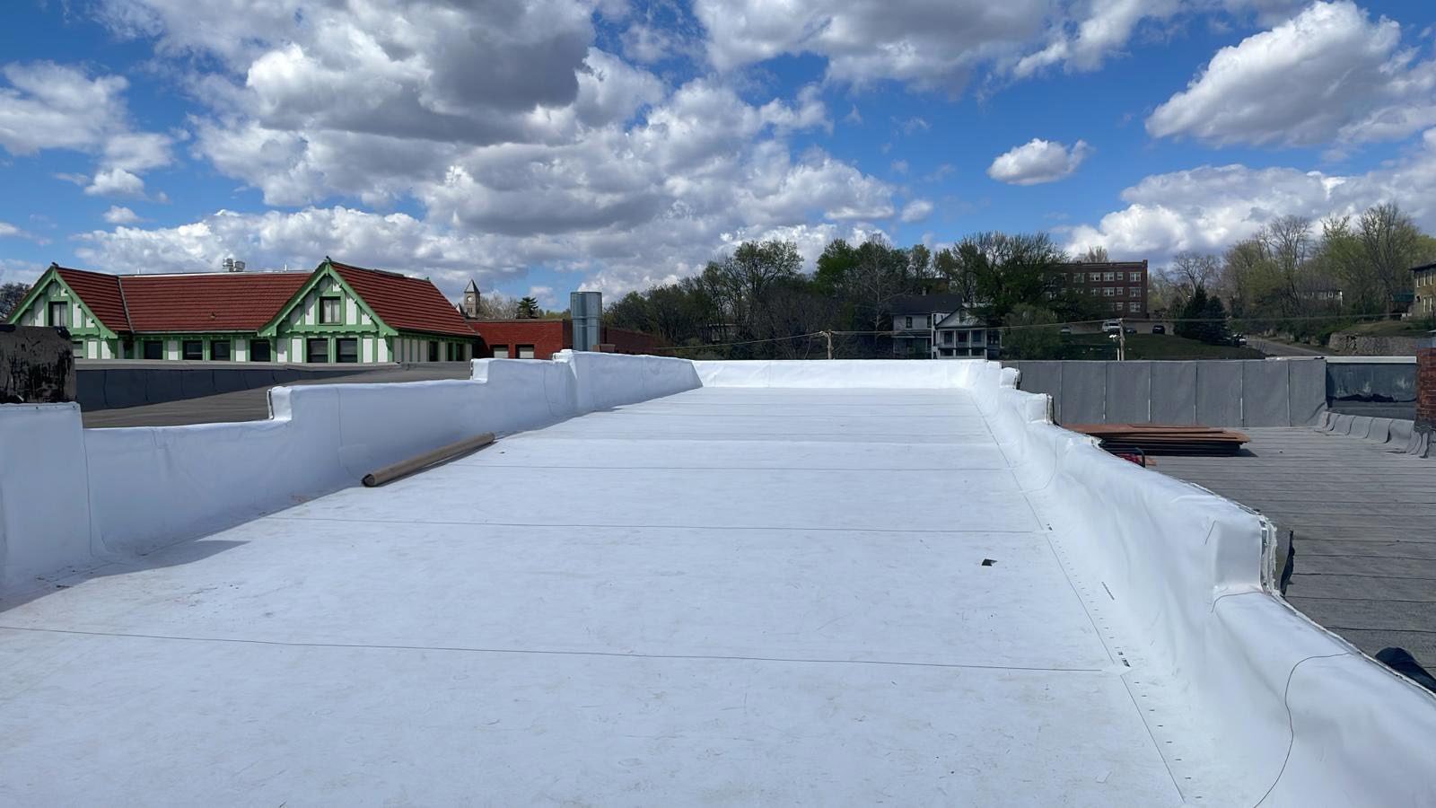 Commercial flat roof surface inspected by RJ Roofing